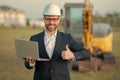 Construction business owner. Man in suit and hardhat halmet at building construction site. Civil engineer worker in