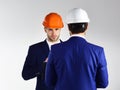 Construction, business people, design concept. People in helmets isolated on white background. Royalty Free Stock Photo