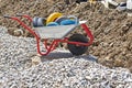 construction cart with wheels on the background of dug earth Royalty Free Stock Photo