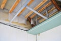 Construction of a ceiling with wooden beams and insulation. Royalty Free Stock Photo