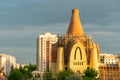 The construction of the church against the sunset. Scaffolding is fixed around the brick dome of the new church. The construction Royalty Free Stock Photo