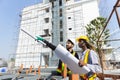 Construction civil engineer man and woman African American checking quality of work in construction site. Team of various Royalty Free Stock Photo