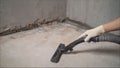 Construction cleaning service sleeve anchor bolt . dust removal with vacuum cleaner. Worker vacuuming concrete floor