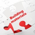 Construction concept: Building Materials on puzzle background Royalty Free Stock Photo