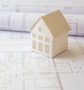 Construction concept. Residential building drawings and architectural house model on an office desk Royalty Free Stock Photo