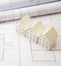 Construction concept. Residential building drawings and architectural house models on an office desk Royalty Free Stock Photo