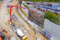 Construction concrete pump pump truck delivers concrete into the concrete wall screed. View from above