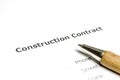 Construction contract with wooden pen