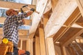 Construction Contractor Worker Attaching Wooden Elements