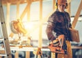 Construction Contractor Worker with Nail Gun in His Hand Royalty Free Stock Photo