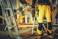 Construction Contractor Worker with a Nail Gun in His Hand Royalty Free Stock Photo