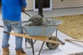 Construction contractors pouring wet concrete while paving a driveway as they work on a concrete construction project Royalty Free Stock Photo