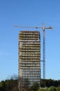 Construction crane above building house Royalty Free Stock Photo