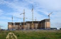 Construction crane above building house Royalty Free Stock Photo