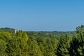 Construction crane above treetops