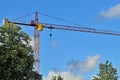 Construction crane against the blue sky Royalty Free Stock Photo