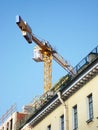 Construction crane on background of blue sky