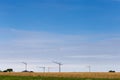 Construction crane behind corn field on far away horizon Royalty Free Stock Photo