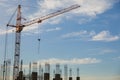 The construction crane and the building against the blue sky Royalty Free Stock Photo