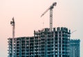 Picture of buildings under construction with construction crane