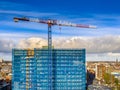 Construction crane building high rise apartment Royalty Free Stock Photo