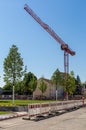 Construction crane on a building site. Construction next to the church. City infrastructure. Construction of a housing estate noah Royalty Free Stock Photo
