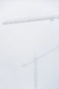 Construction crane in dense fog Royalty Free Stock Photo