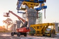 Construction crane and girder of bridge construction site.