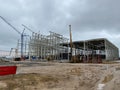 Construction crane for heavy lifting on a construction site of an industrial facility