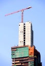 Construction crane on high buiding site Royalty Free Stock Photo