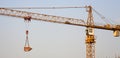 Construction crane lifting cargo Royalty Free Stock Photo