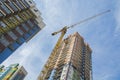 Construction crane near the high building Royalty Free Stock Photo