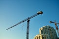 A construction crane near a house Royalty Free Stock Photo