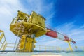 Construction crane on offshore oil and gas wellhead remote platform Royalty Free Stock Photo