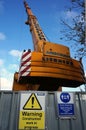 Ainscough Liebherr construction crane with safety barrier. & warning signs