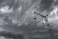 Construction crane silhouette on the background of storm clouds Royalty Free Stock Photo