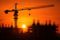 Construction Crane Silhouette Over Building Framework During Dramatic Sunset Royalty Free Stock Photo