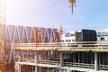 Construction crane tower on blue sky background. Crane and building working progress. Worker. Empty Space for text. Construction c Royalty Free Stock Photo