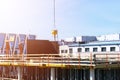 Construction crane tower on blue sky background. Crane and building working progress. Worker. Empty Space for text. Construction c Royalty Free Stock Photo