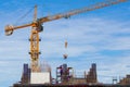 Construction crane and worker of building industry with blue sky Royalty Free Stock Photo