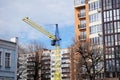 Construction crane yellow blue near the building