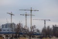 Construction cranes building a new house
