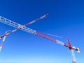 Construction cranes on a building site Royalty Free Stock Photo