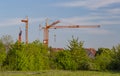 Construction cranes at a building site in a new development area in Germany Royalty Free Stock Photo