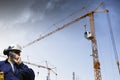 Construction cranes and building worker