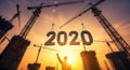 Construction Cranes Building the Year 2020 at Sunset Royalty Free Stock Photo