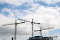 Construction cranes in city skyline Royalty Free Stock Photo