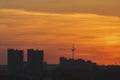 Construction cranes near residential apartments - view on sunrise, horizontal Royalty Free Stock Photo