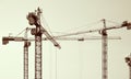 Construction cranes silhouettes. Royalty Free Stock Photo