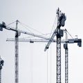 Construction cranes silhouettes. Royalty Free Stock Photo